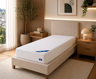 Matelas Sensospring 90x200 cm Oli posé sur un lit 1 personne dans une chambre moderne – confort équilibré à ressorts ensachés